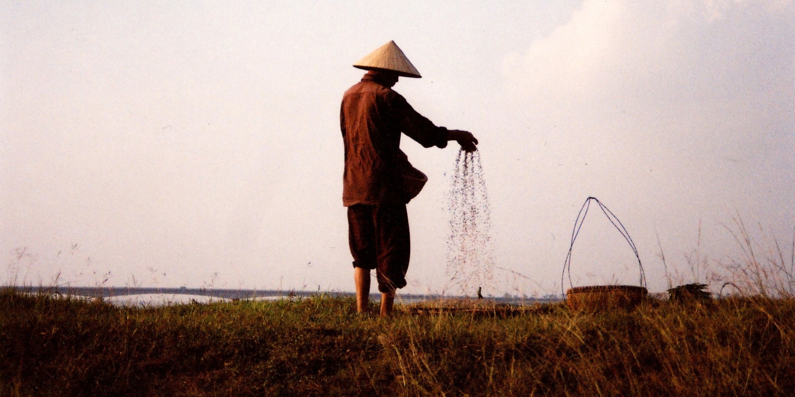 Sifting seeds in a field along Red River in Northern Vietnam. Photo: Quy-Toan Do / World Bank