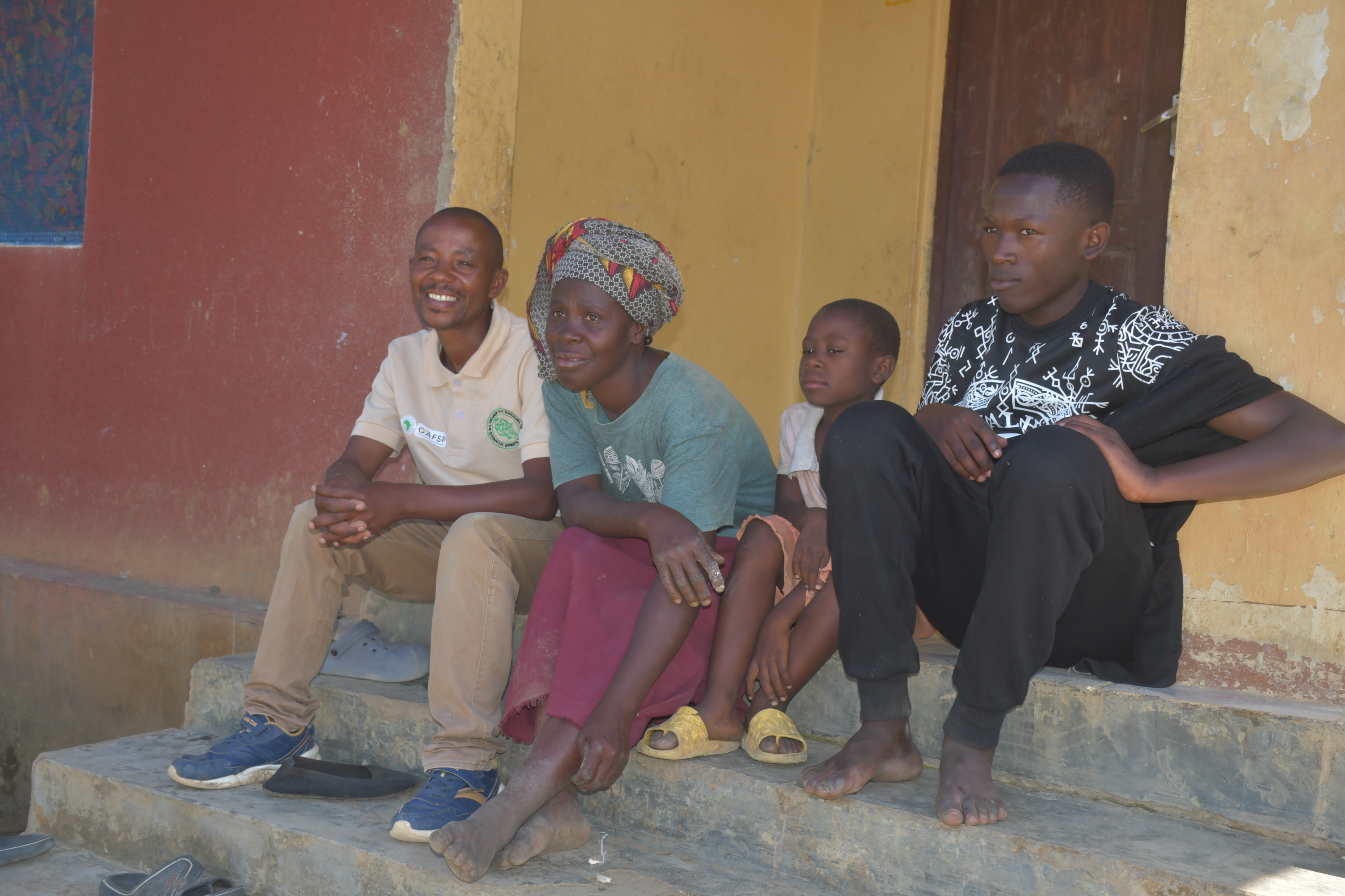 Mkude from Pinde Village, seated with his wife and two children. Photo: ESAFF
