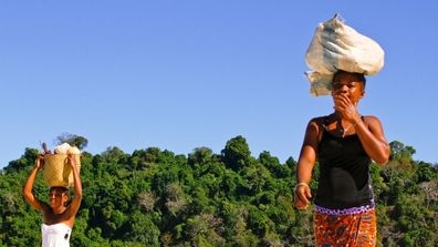 woman carrying cargo on head